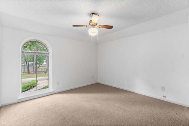 6623 Coral Ridge Rd, Houston, TX 77069 - unfurnished room with carpet floors, baseboards, ceiling fan, and a textured ceiling