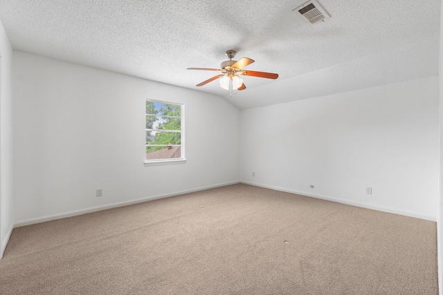6623 Coral Ridge Rd, Houston, TX 77069 - carpeted spare room featuring a ceiling fan, a textured ceiling, baseboards, and vaulted ceiling