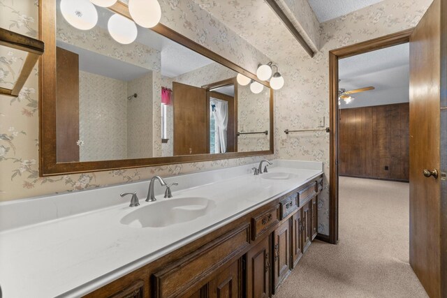 6623 Coral Ridge Rd, Houston, TX 77069 - full bathroom featuring wallpapered walls, double vanity, and a ceiling fan