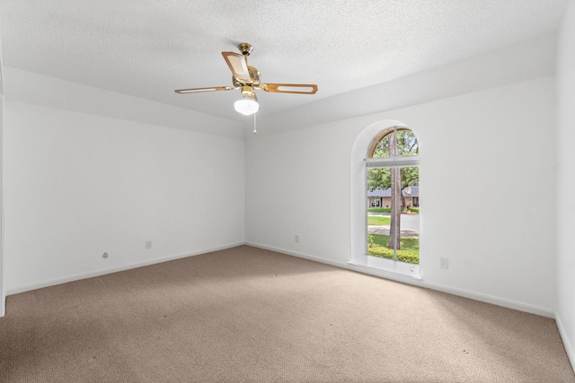 6623 Coral Ridge Rd, Houston, TX 77069 - carpeted spare room with a ceiling fan, baseboards, and a textured ceiling