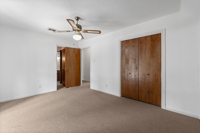 6623 Coral Ridge Rd, Houston, TX 77069 - unfurnished bedroom featuring carpet, baseboards, a closet, ceiling fan, and a textured ceiling
