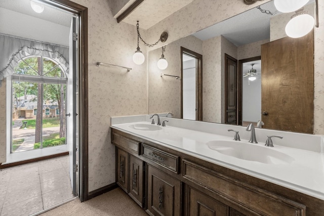 6623 Coral Ridge Rd, Houston, TX 77069 - full bath with wallpapered walls, double vanity, and baseboards