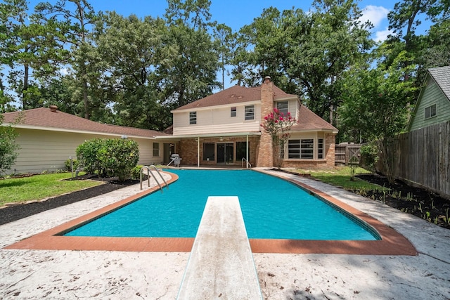 6623 Coral Ridge Rd, Houston, TX 77069 - view of swimming pool with a diving board and a patio area