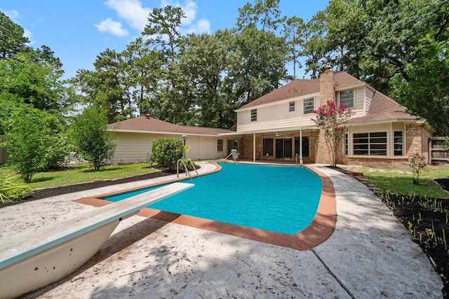 6623 Coral Ridge Rd, Houston, TX 77069 - outdoor pool with a patio area and a diving board