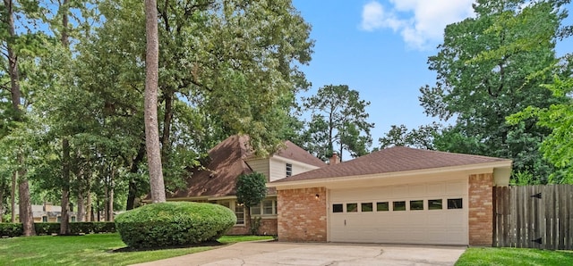 6623 Coral Ridge Rd, Houston, TX 77069 - view of front of home with brick siding, driveway, and a garage