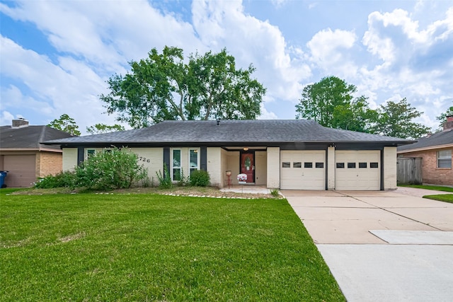 15726 Blackhawk Blvd, Friendswood, TX 77546 - ranch-style house with an attached garage, driveway, a front yard, and brick siding