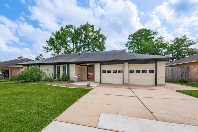 15726 Blackhawk Blvd, Friendswood, TX 77546 - ranch-style home with concrete driveway, a garage, and brick siding