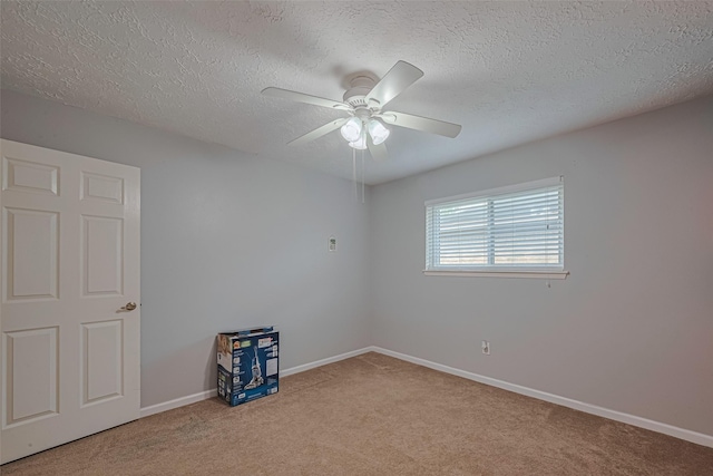 15726 Blackhawk Blvd, Friendswood, TX 77546 - carpeted empty room with a textured ceiling, ceiling fan, and baseboards
