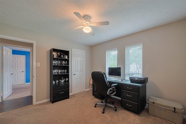 15726 Blackhawk Blvd, Friendswood, TX 77546 - office area featuring ceiling fan, light colored carpet, a textured ceiling, and baseboards