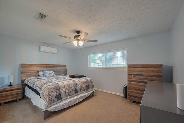 15726 Blackhawk Blvd, Friendswood, TX 77546 - bedroom with carpet floors, a wall mounted air conditioner, a textured ceiling, baseboards, and a ceiling fan
