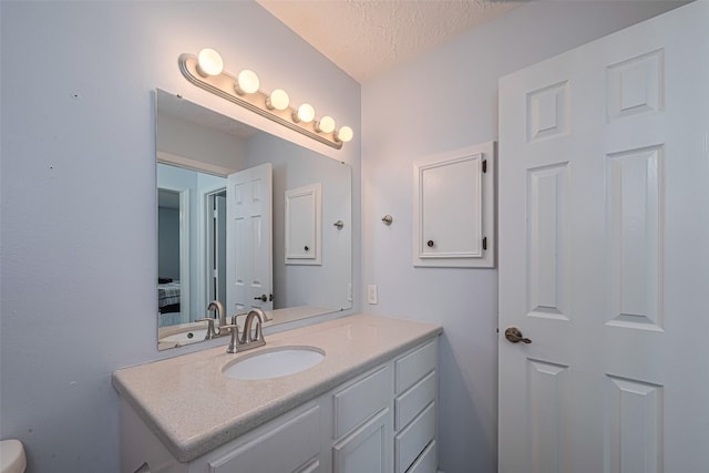 15726 Blackhawk Blvd, Friendswood, TX 77546 - bathroom with vanity and a textured ceiling