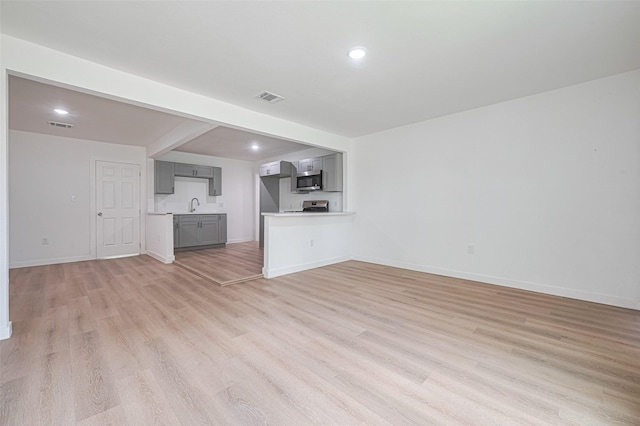 606 Cresline St, Houston, TX 77076 - unfurnished living room with light wood finished floors and recessed lighting