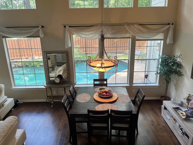 3 Candle Pine Pl, The Woodlands, TX 77381 - dining room with hardwood / wood-style floors, baseboards, and healthy amount of natural light