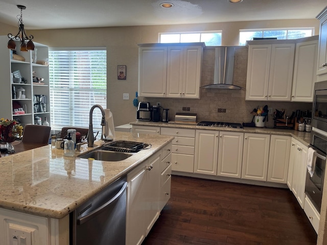 3 Candle Pine Pl, The Woodlands, TX 77381 - kitchen featuring a sink, stainless steel dishwasher, wall chimney exhaust hood, wall oven, and gas stovetop