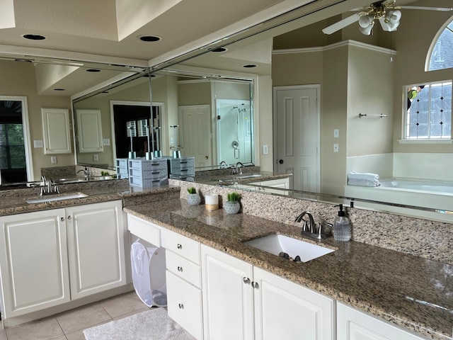 3 Candle Pine Pl, The Woodlands, TX 77381 - bathroom with vanity, ceiling fan, tile patterned floors, a bath, and a shower stall