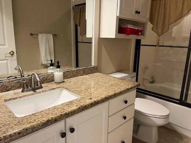 3 Candle Pine Pl, The Woodlands, TX 77381 - bathroom with toilet, vanity, shower / bath combination with glass door, and tile patterned flooring