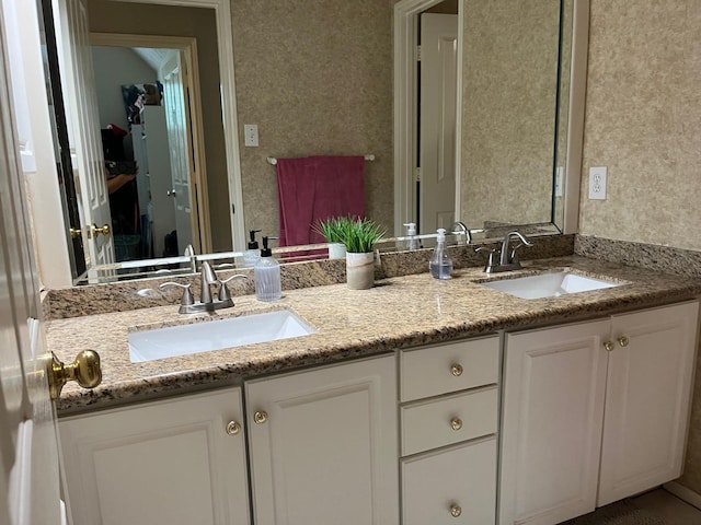 3 Candle Pine Pl, The Woodlands, TX 77381 - bathroom featuring double vanity and wallpapered walls