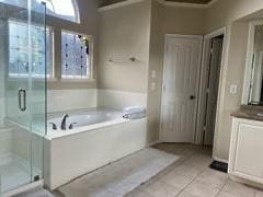 3 Candle Pine Pl, The Woodlands, TX 77381 - full bath with tile patterned flooring, a bath, a shower stall, and vanity