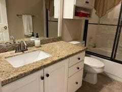 3 Candle Pine Pl, The Woodlands, TX 77381 - bathroom with toilet, vanity, and shower / bath combination with glass door