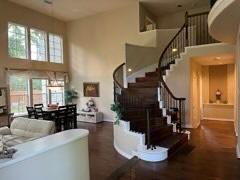 3 Candle Pine Pl, The Woodlands, TX 77381 - foyer with a high ceiling, stairs, and wood finished floors