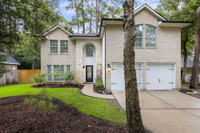 38 Florian Ct, Conroe, TX 77385 - view of front facade featuring an attached garage, driveway, and brick siding
