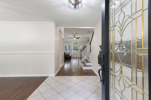 38 Florian Ct, Conroe, TX 77385 - foyer featuring wood finished floors, stairs, baseboards, and a ceiling fan