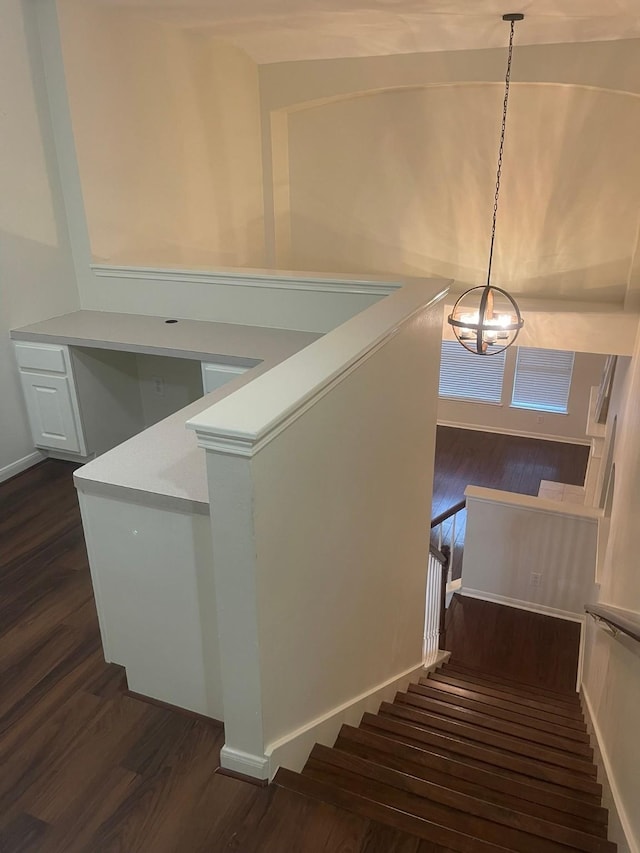 38 Florian Ct, Conroe, TX 77385 - stairs featuring wood finished floors and a chandelier