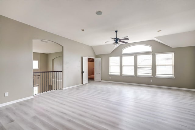 17215 Astrachan Rd, Richmond, TX 77407 - unfurnished room with ceiling fan, light wood-style floors, plenty of natural light, vaulted ceiling, and baseboards