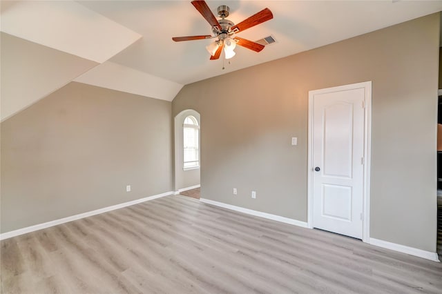 17215 Astrachan Rd, Richmond, TX 77407 - empty room with ceiling fan, light wood-style flooring, baseboards, and lofted ceiling