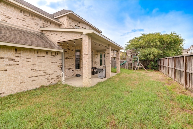 17215 Astrachan Rd, Richmond, TX 77407 - view of yard with a patio area and a playground
