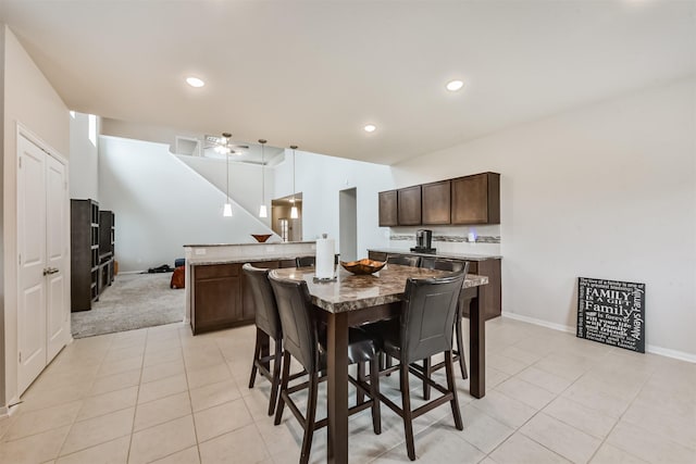 3607 Crosspointe Pass, Angleton, TX 77515 - dining area with light tile patterned floors, ceiling fan, baseboards, recessed lighting, and light colored carpet