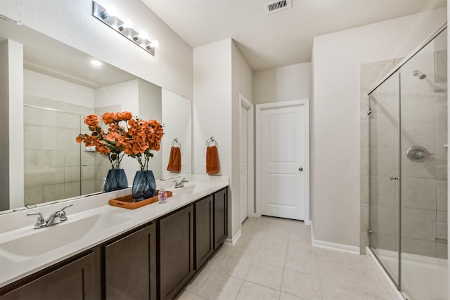 3607 Crosspointe Pass, Angleton, TX 77515 - bathroom featuring tile patterned flooring, double vanity, a stall shower, and baseboards