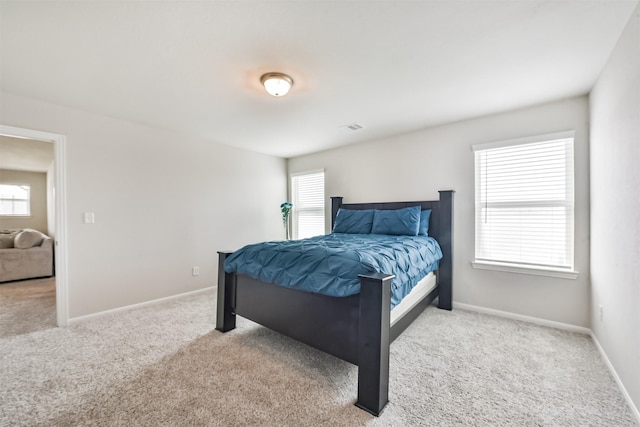 3607 Crosspointe Pass, Angleton, TX 77515 - bedroom with carpet, multiple windows, and baseboards