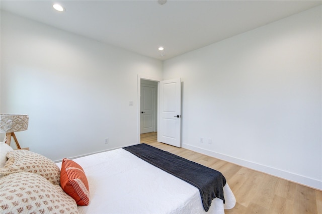4043 Buck St, Houston, TX 77020 - bedroom featuring light wood-style flooring, recessed lighting, and baseboards