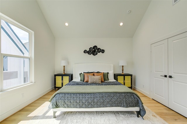 4043 Buck St, Houston, TX 77020 - bedroom with lofted ceiling, light wood-style flooring, recessed lighting, a closet, and baseboards