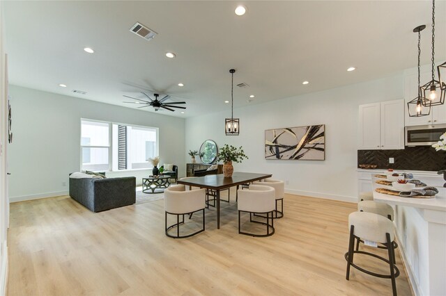 4041 Buck St, Houston, TX 77020 - dining space with recessed lighting, light wood-type flooring, ceiling fan, and baseboards