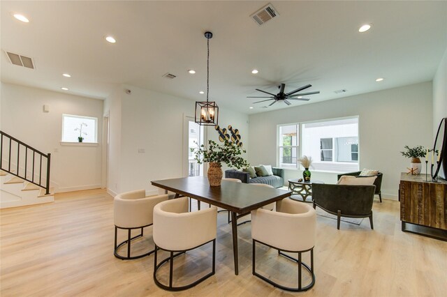 4041 Buck St, Houston, TX 77020 - dining space featuring light wood finished floors, stairway, recessed lighting, baseboards, and ceiling fan