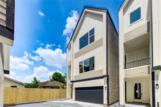 4041 Buck St, Houston, TX 77020 - view of front of property with a garage and board and batten siding