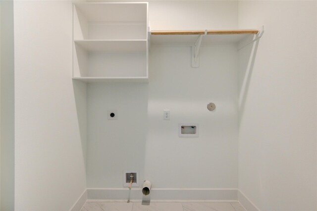 4041 Buck St, Houston, TX 77020 - laundry room with hookup for a gas dryer, hookup for an electric dryer, hookup for a washing machine, baseboards, and marble finish flooring