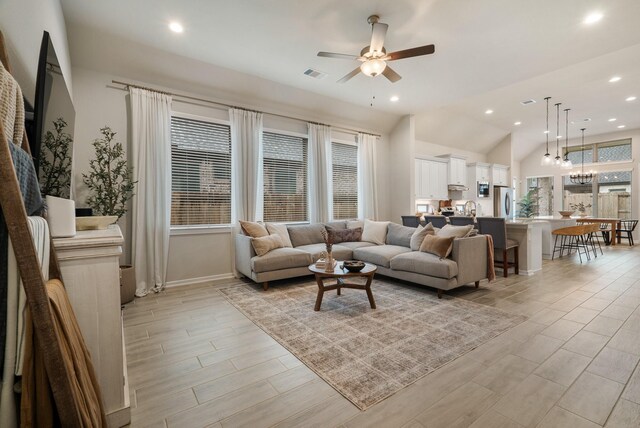 29639 Mahogany View Ln, Fulshear, TX 77441 - living area with a ceiling fan, light wood-style floors, recessed lighting, vaulted ceiling, and baseboards