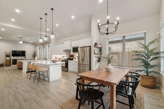 29639 Mahogany View Ln, Fulshear, TX 77441 - dining area with recessed lighting, a chandelier, a ceiling fan, and light wood-type flooring