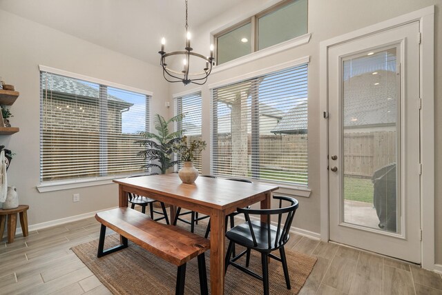 29639 Mahogany View Ln, Fulshear, TX 77441 - dining area featuring a chandelier, baseboards, and light wood-style floors