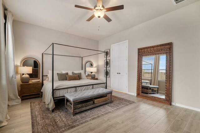 29639 Mahogany View Ln, Fulshear, TX 77441 - bedroom with light wood finished floors, baseboards, and a ceiling fan