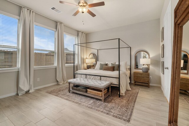 29639 Mahogany View Ln, Fulshear, TX 77441 - bedroom with baseboards, ceiling fan, and light wood-type flooring