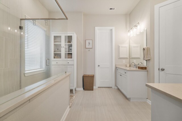 29639 Mahogany View Ln, Fulshear, TX 77441 - bathroom featuring vanity, a stall shower, and baseboards