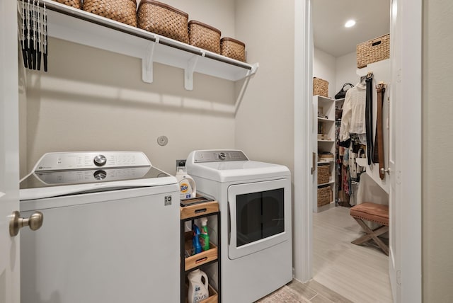 29639 Mahogany View Ln, Fulshear, TX 77441 - laundry area with washer and clothes dryer, light wood-style flooring, and recessed lighting