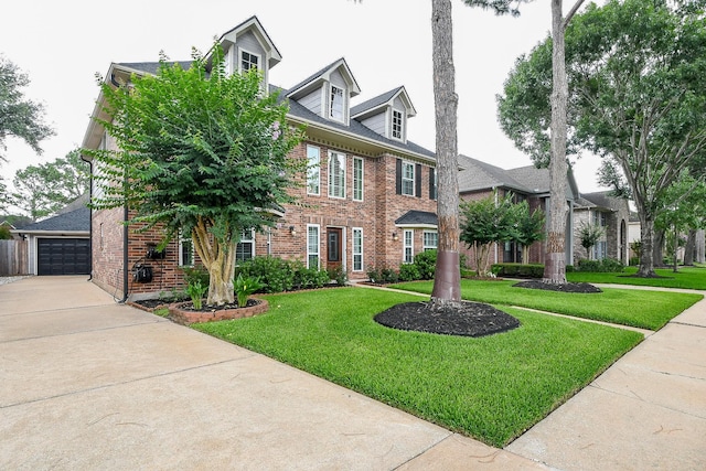 7926 Millers Way, Houston, TX 77095 - colonial home with brick siding, a front lawn, a garage, and concrete driveway