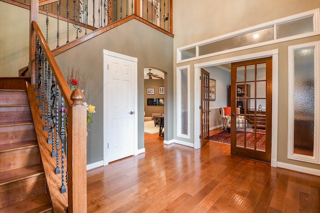 7926 Millers Way, Houston, TX 77095 - foyer featuring french doors, wood finished floors, baseboards, stairway, and a high ceiling