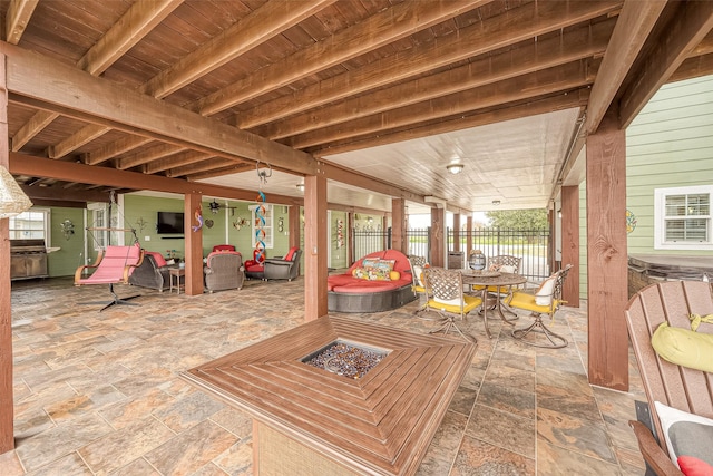 792 W Bayshore Dr, Palacios, TX 77465 - wooden terrace featuring a patio area, a fire pit, and outdoor dining area