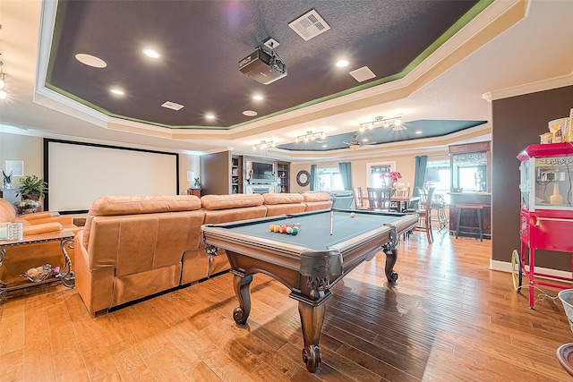 792 W Bayshore Dr, Palacios, TX 77465 - game room with a raised ceiling, crown molding, billiards, light wood-style floors, and recessed lighting